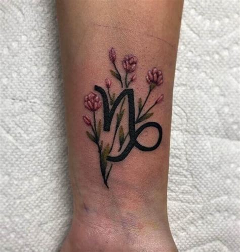 capricorn tattoos with flowers|tribal capricorn zodiac sign tattoos.